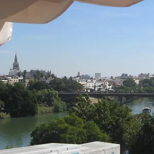 https://trianabridgeviews-atico-con-vistas-al-puente-de-triana.es-andalucia.com